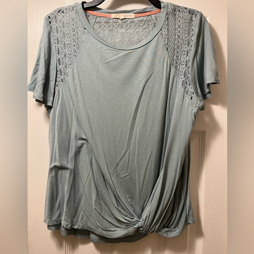 Light grayish green short sleeve top with twist front and crochet details